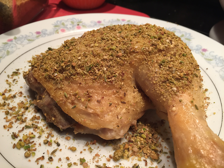 Dukkah on oven roasted chicken leg-thigh quarter